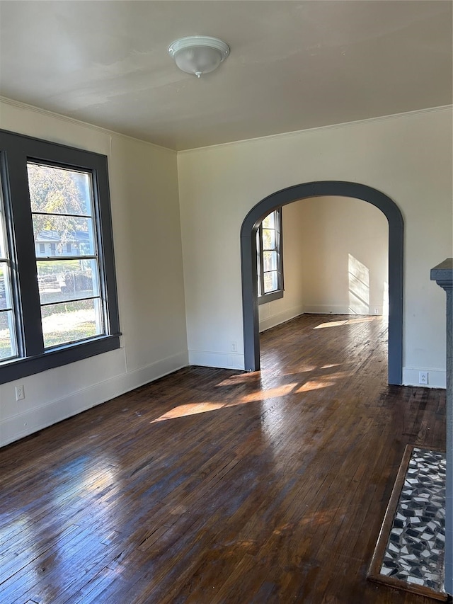 unfurnished room featuring dark wood-type flooring