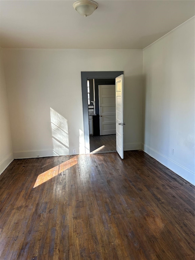 unfurnished room with dark hardwood / wood-style floors