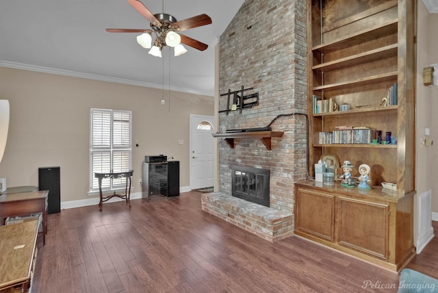 living room featuring a fireplace, ornamental molding, hardwood / wood-style floors, and ceiling fan