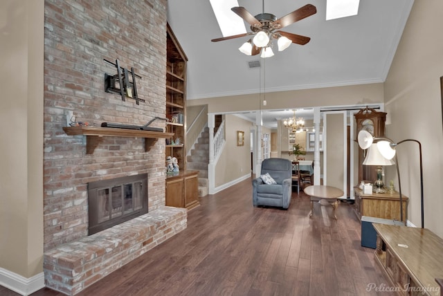 living room with high vaulted ceiling, ceiling fan with notable chandelier, a fireplace, ornamental molding, and dark hardwood / wood-style floors