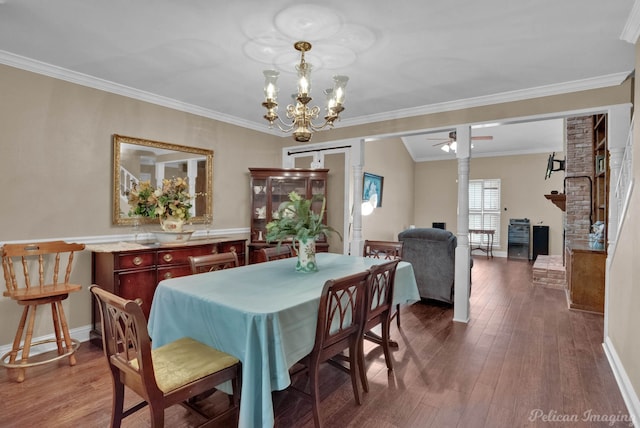 dining area with ceiling fan with notable chandelier, crown molding, and dark hardwood / wood-style flooring