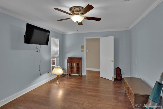 unfurnished room with ceiling fan, ornamental molding, and dark wood-type flooring