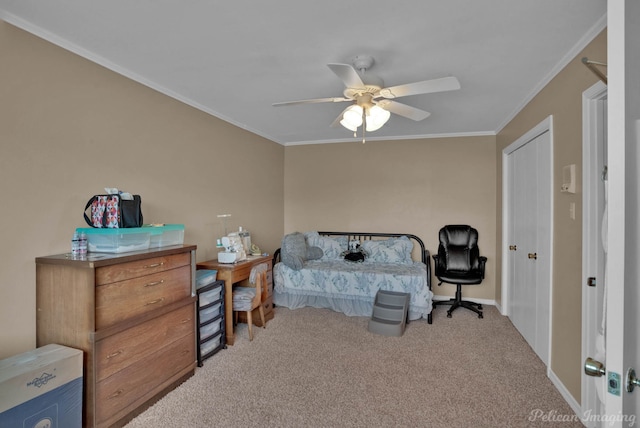 carpeted bedroom with crown molding and ceiling fan