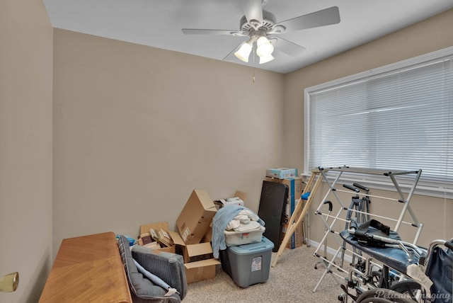 misc room featuring light carpet and ceiling fan