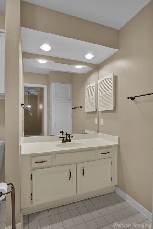 bathroom with vanity and tile patterned flooring