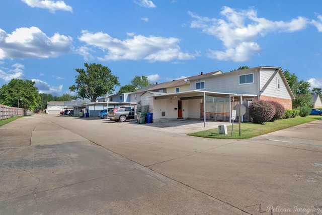 view of front of home featuring a carport