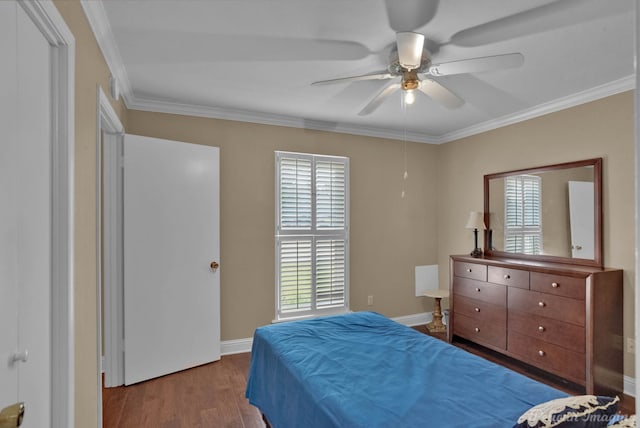 bedroom with ceiling fan, ornamental molding, and hardwood / wood-style floors