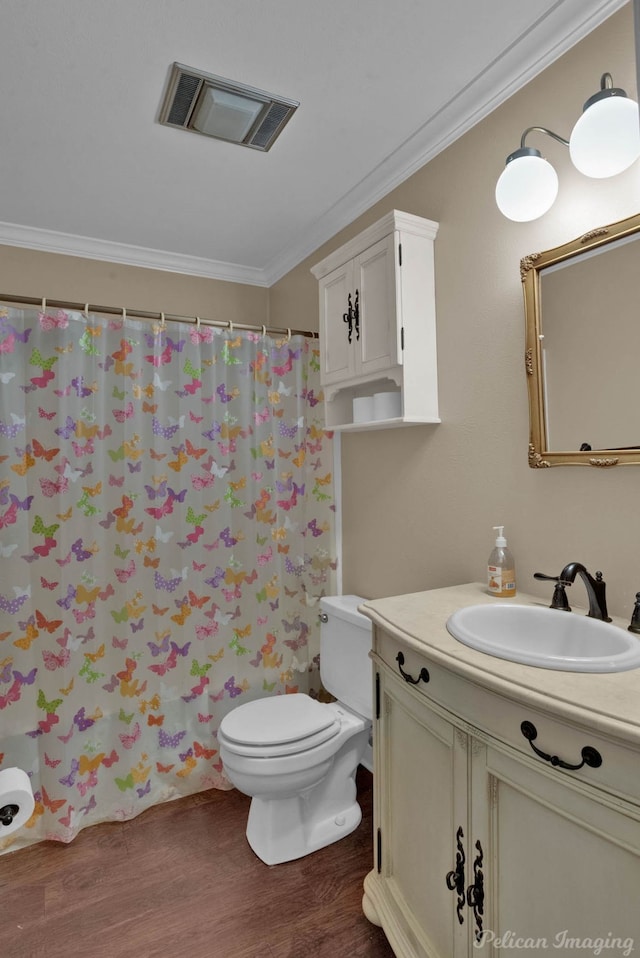 bathroom with wood-type flooring, a shower with curtain, crown molding, vanity, and toilet