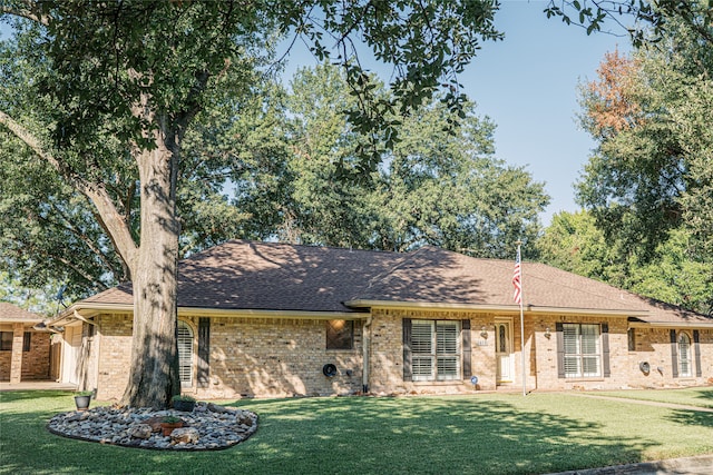 rear view of property featuring a yard