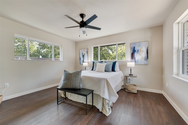 bedroom featuring ceiling fan and dark wood-type flooring