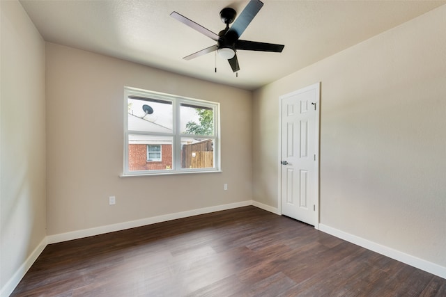 interior space with dark hardwood / wood-style floors and ceiling fan