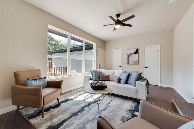 living room with ceiling fan and hardwood / wood-style flooring