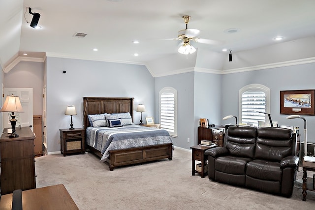 carpeted bedroom with ceiling fan, crown molding, vaulted ceiling, and multiple windows