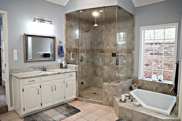 bathroom with ornamental molding, tile patterned floors, vanity, and separate shower and tub