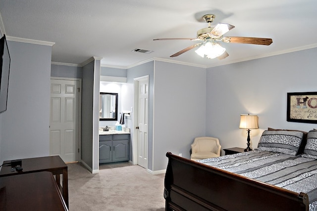 carpeted bedroom featuring ceiling fan, sink, ensuite bath, and ornamental molding