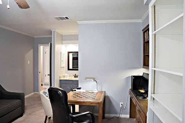 carpeted office space with crown molding and ceiling fan