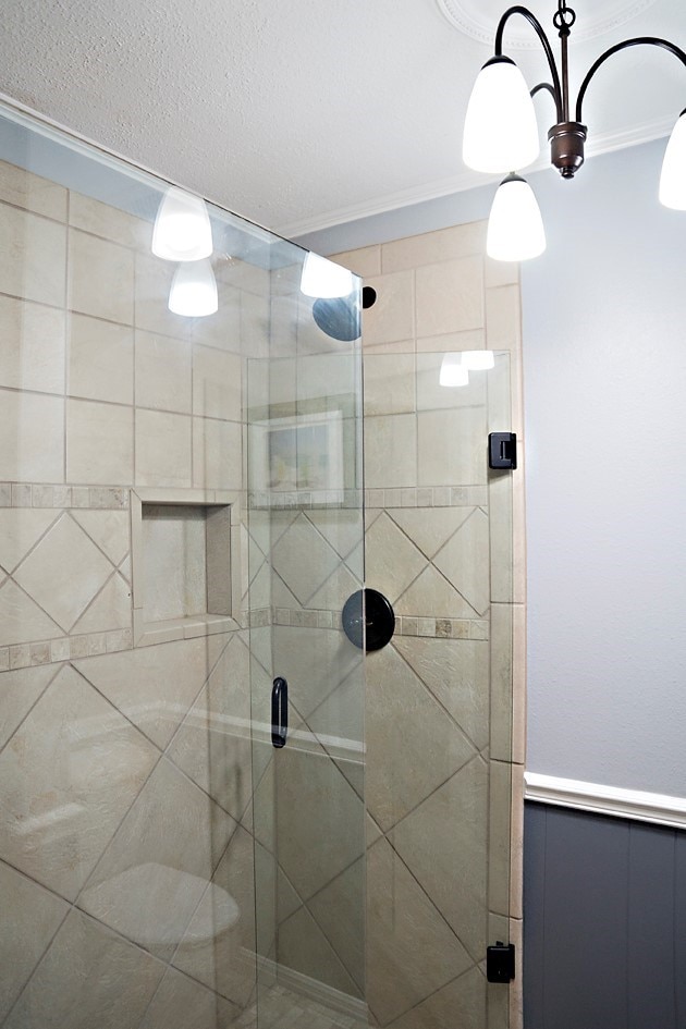 bathroom with a shower with shower door