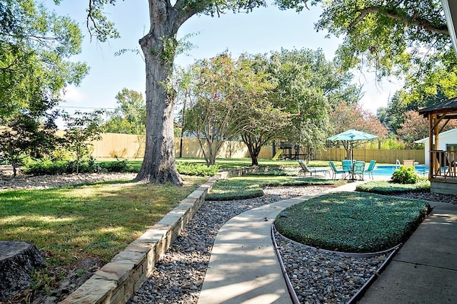 view of home's community with a lawn, a patio, a swimming pool, and a gazebo