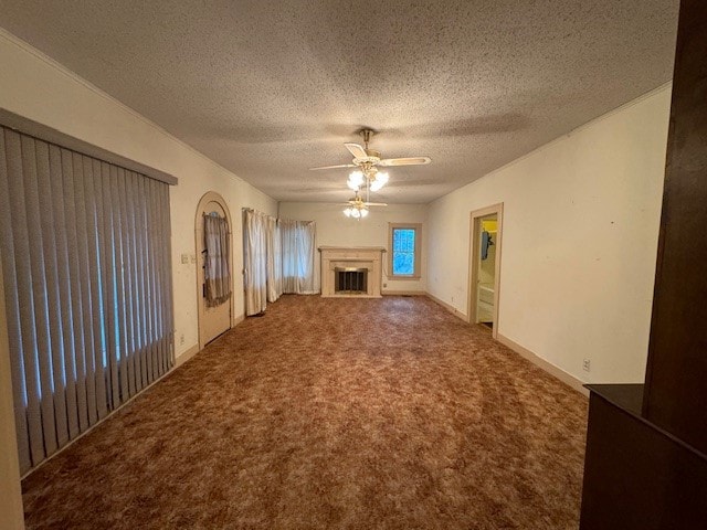 unfurnished living room with ceiling fan, a textured ceiling, and carpet flooring