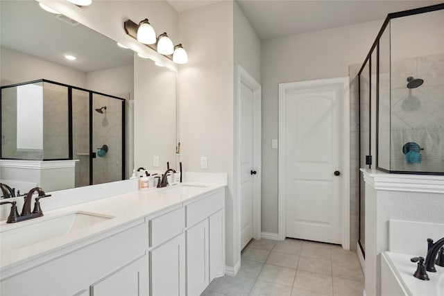 bathroom featuring walk in shower, vanity, and tile patterned floors