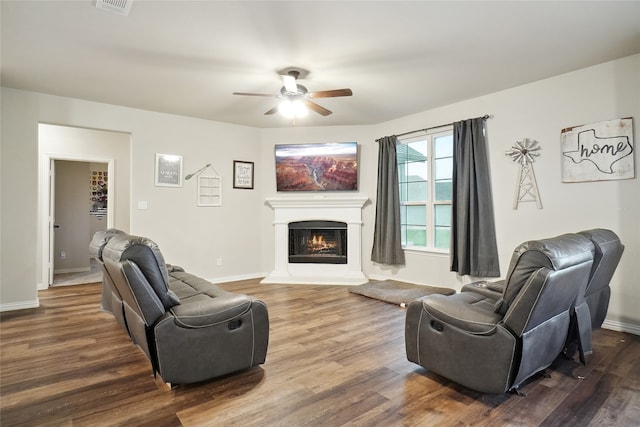 living room with wood-type flooring and ceiling fan