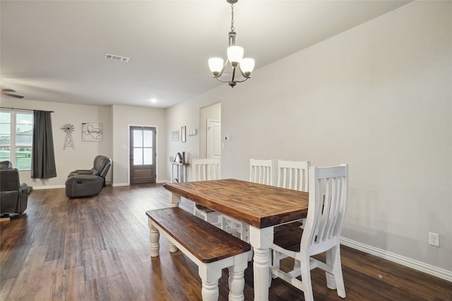 dining area featuring dark wood-type flooring