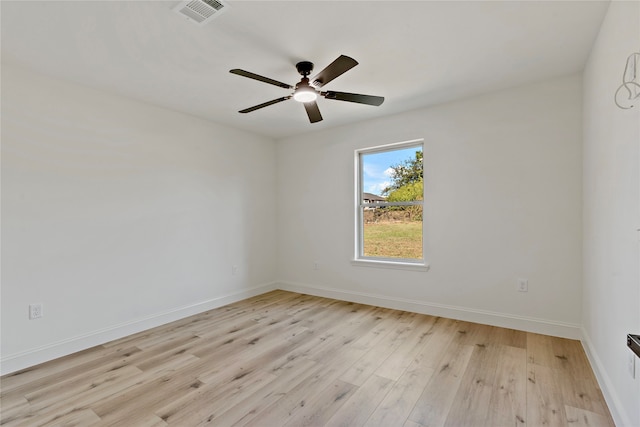 spare room featuring ceiling fan and light hardwood / wood-style flooring