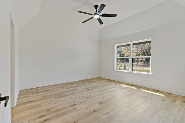 unfurnished room with vaulted ceiling, ceiling fan, and light hardwood / wood-style flooring