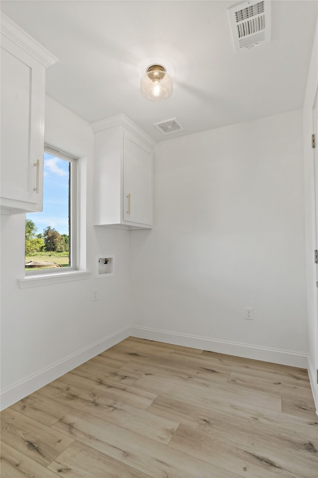 spare room featuring light wood-type flooring