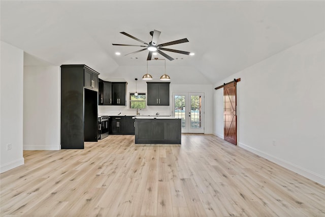 306 Sunset, Roxton, TX 75477 - kitchen with a ceiling fan, french doors, stainless steel range oven, light wood-style flooring, and vaulted ceiling