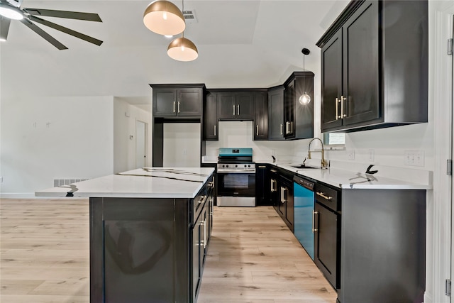 kitchen with ceiling fan, pendant lighting, stainless steel range oven, black dishwasher, and light wood-type flooring