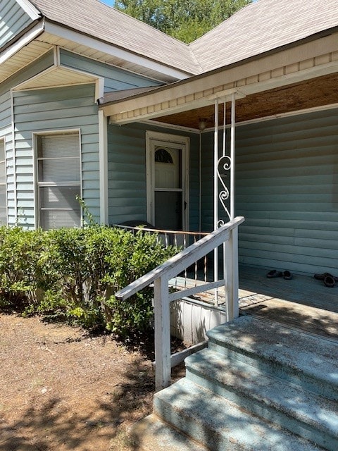 doorway to property featuring a porch