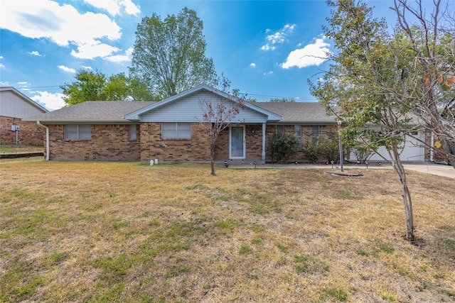 ranch-style house with a front yard and a garage