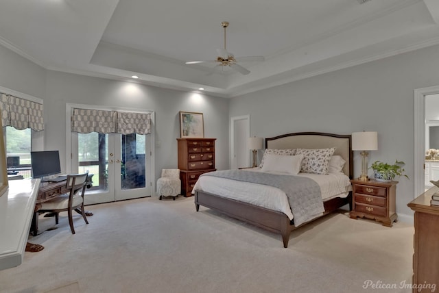 bedroom featuring access to exterior, light colored carpet, a raised ceiling, ornamental molding, and ceiling fan