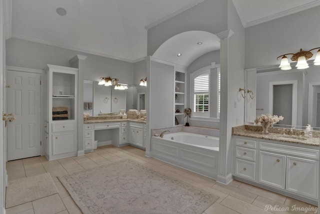 bathroom with tile patterned flooring, a bathtub, built in shelves, crown molding, and vanity