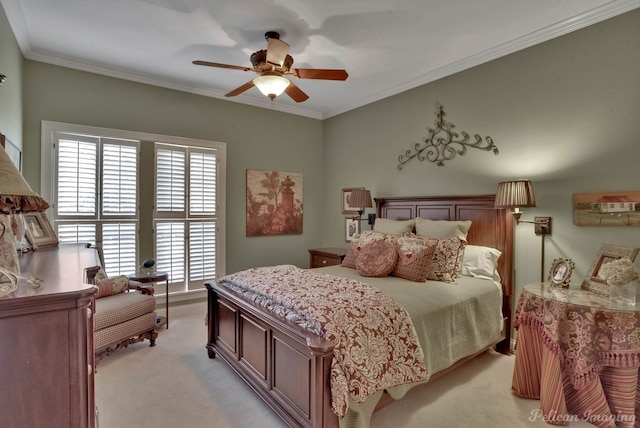 bedroom featuring ornamental molding, ceiling fan, and light colored carpet