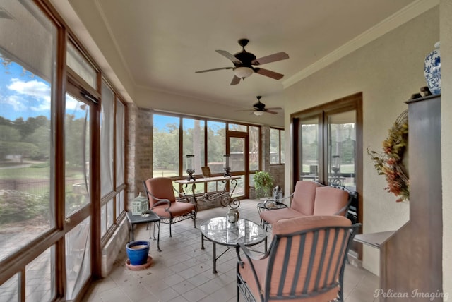 sunroom / solarium featuring ceiling fan