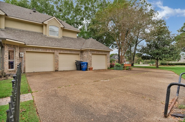 view of side of home featuring a garage