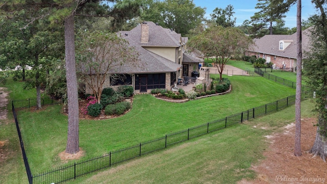 view of front facade with a front lawn and a patio area