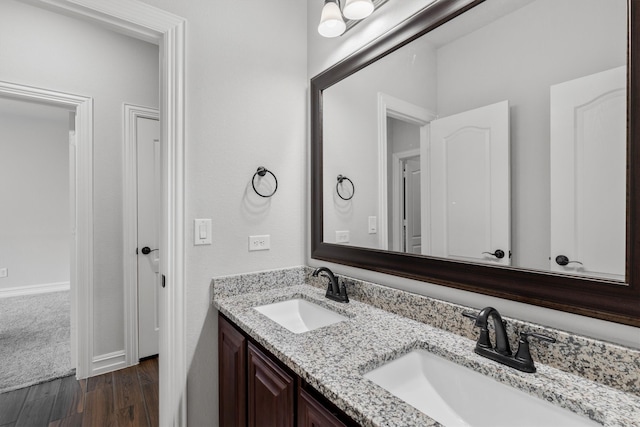 bathroom with wood-type flooring and vanity