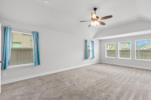 unfurnished room with lofted ceiling, carpet flooring, and ceiling fan