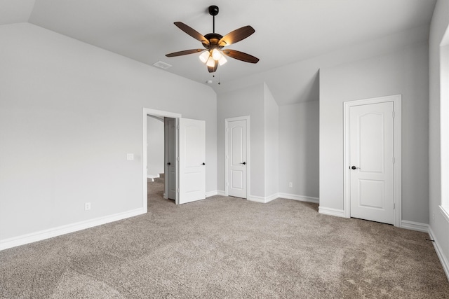 unfurnished bedroom featuring lofted ceiling, ceiling fan, and carpet floors