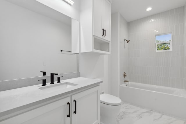 full bathroom with vanity, toilet, and tiled shower / bath