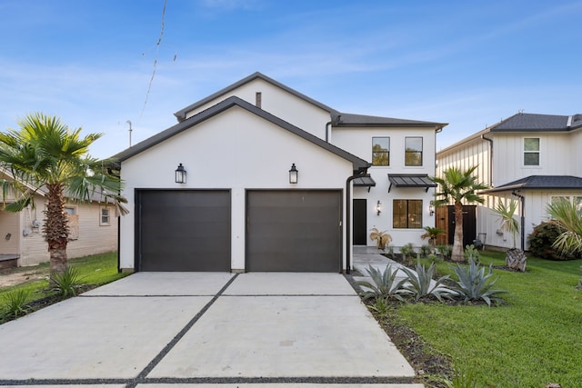 view of front of house with a garage and a front yard