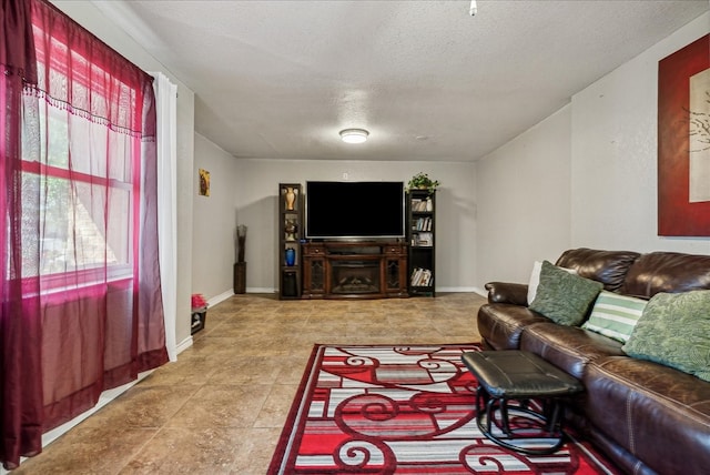 living room featuring a textured ceiling