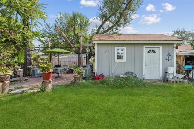 view of outdoor structure featuring a yard