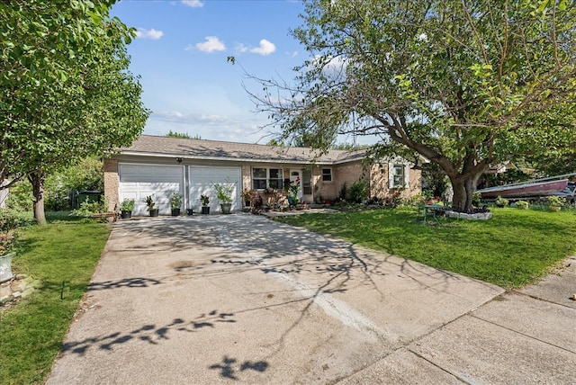 single story home featuring a garage and a front lawn