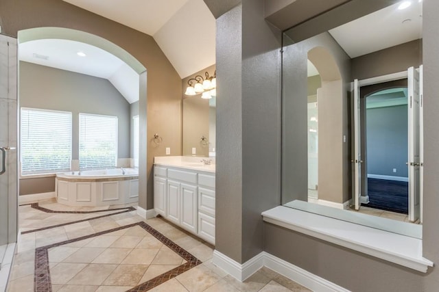 5802 Parker Village Dr, Parker, TX 75002 - bathroom featuring a garden tub, vanity, lofted ceiling, and baseboards