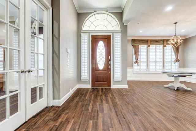 5802 Parker Village Dr, Parker, TX 75002 - foyer entrance featuring dark wood-style flooring, a chandelier, crown molding, healthy amount of natural light, and baseboards