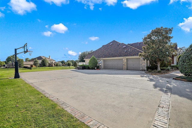 exterior space featuring a garage and a front yard